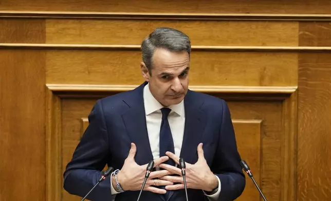 Greece Prime Minister Kyriakos Mitsotakis speaks during a parliament session in Athens, on Thursday, March 28, 2024. A Greek opposition party Tuesday submitted a motion of no-confidence against the government, saying that it tried to cover up its responsibility over a deadly rail disaster last year that shocked Greece. The three-day debate in parliament is due to end with a vote late Thursday. March 28. (AP Photo/Petros Giannakouris)