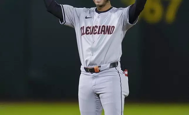 Cleveland Guardians' Brayan Rocchio celebrates after hitting a two-run double against the Oakland Athletics during the fourth inning of a baseball game Thursday, March 28, 2024, in Oakland, Calif. (AP Photo/Godofredo A. Vásquez)