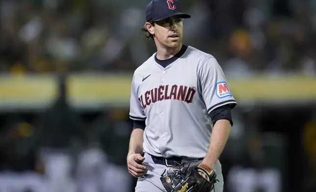Cleveland Guardians' Shane Bieber walks to the dugout after pitching against the Oakland Athletics during the sixth inning of a baseball game Thursday, March 28, 2024, in Oakland, Calif. (AP Photo/Godofredo A. Vásquez)