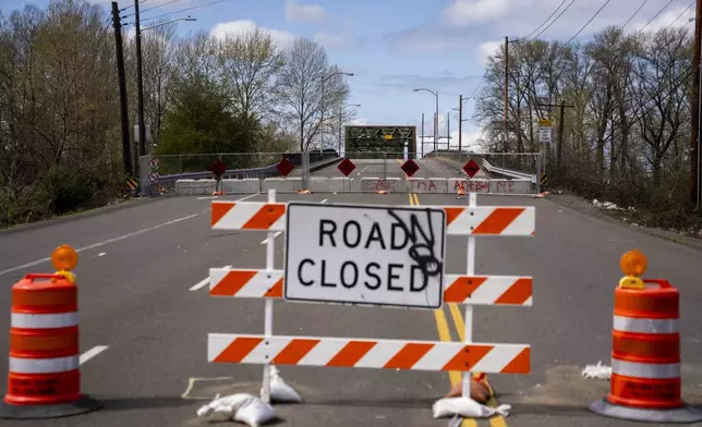 The Fishing Wars Memorial Bridge, which has been closed indefinitely since October 2023 after the Federal Highway Administration raised safety concerns, is shown Tuesday, March 26, 2024, in Tacoma, Wash. Nearby business owners say they have noticed a decrease in customers as traffic has slowed on their street due to the closure. (AP Photo/Lindsey Wasson)