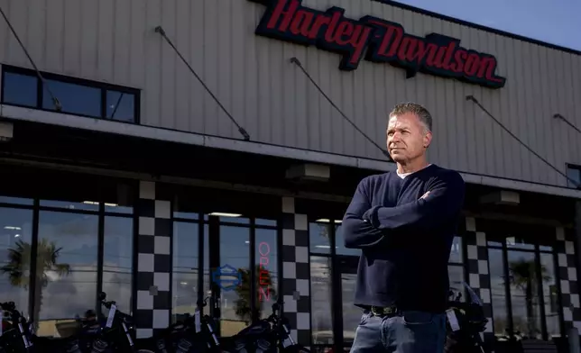 Destination Harley-Davidson owner Ed Wallace, who says his location has had a loss of sales in merchandise and motorcycles since the nearby Fishing Wars Memorial Bridge closed last year, poses for a portrait Tuesday, March 26, 2024, in Tacoma, Wash. The bridge has been closed indefinitely since October 2023 after the Federal Highway Administration raised safety concerns, straining businesses as traffic bypasses their street. (AP Photo/Lindsey Wasson)