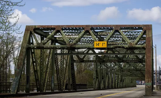 The Fishing Wars Memorial Bridge, which has been closed indefinitely since October 2023 after the Federal Highway Administration raised safety concerns, is shown Tuesday, March 26, 2024, in Tacoma, Wash. Nearby business owners say they have noticed a decrease in customers as traffic has slowed on their street due to the closure. (AP Photo/Lindsey Wasson)