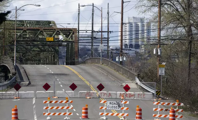 The Fishing Wars Memorial Bridge, which has been closed indefinitely since October 2023 after the Federal Highway Administration raised safety concerns, is shown Tuesday, March 26, 2024, in Tacoma, Wash. Nearby business owners say they have noticed a decrease in customers as traffic has slowed on their street due to the closure. (AP Photo/Lindsey Wasson)