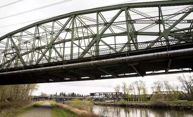 The Fishing Wars Memorial Bridge, which has been closed indefinitely since October 2023 after the Federal Highway Administration raised safety concerns, is shown Tuesday, March 26, 2024, in Tacoma, Wash. Nearby business owners say they have noticed a decrease in customers as traffic has slowed on their street due to the closure. (AP Photo/Lindsey Wasson)