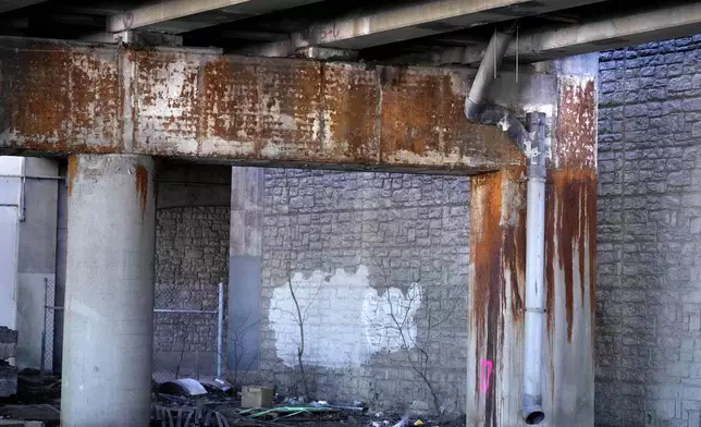 Rust stains are seen through the concrete of the understructure of the Washington Bridge, Friday, March 8, 2024, in East Providence, R.I. The closure of a section of the bridge, and onramps, due to failure of some bridge components, has caused a significant loss to local businesses. (AP Photo/Charles Krupa)