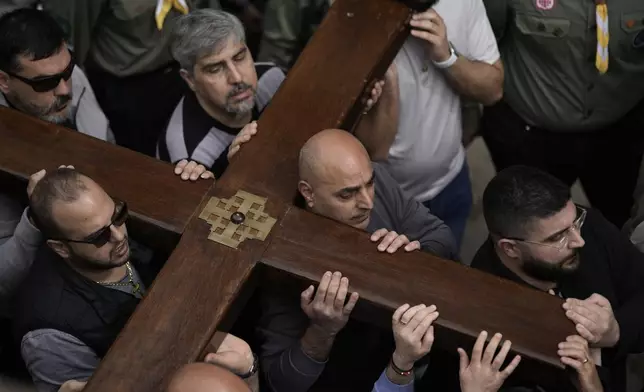 Christians walk the Way of the Cross procession that commemorates Jesus Christ's crucifixion on Good Friday, in the Old City of Jerusalem, Friday, March 29, 2024. (AP Photo/Leo Correa)