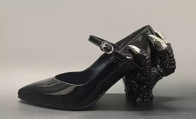 This photo provided by Ryosuke Matsui shows one of the shoes with a Godzilla-themed design by Matsui, taken in Tokyo in October 2023. Those shoes were worn by filmmakers and actors of “Godzilla Minus One” during the Oscars. One Japanese creation grabbing attention on the Oscars red carpet wasn't a movie: the kitsch shoes that seemed to be clenched in Godzilla's claw. They were the work of Matsui, who recently described his joy at seeing “Godzilla Minus One” director Takashi Yamazaki and his Shirogumi special-effects team walk the red carpet and win the visual effects Oscar, all while wearing his shoes. (Courtesy of Ryosuke Matsui via AP)