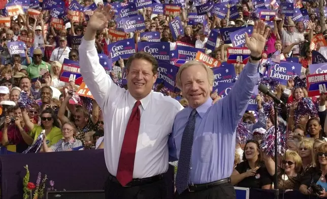 FILE - Democratic presidential candidate Vice President Al Gore, left, and his running mate, vice presidential candidate Sen. Joe Lieberman, of Connecticut, wave to supporters at a campaign rally in Jackson, Tenn., Oct. 25, 2000. A funeral for Lieberman will be held Friday, March 29, 2024, in his hometown of Stamford, Conn. Lieberman died in New York City on Wednesday, March 27, at age 82. (AP Photo/Stephan Savoia, File)