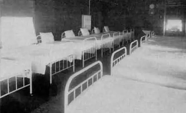 This undated image provided by the Alaska State Library shows the beds at Morningside Hospital in Portland, Ore. Volunteers have spent years digging through old records to identify about 5,500 Alaskans who were committed to a mental hospital in Oregon before Alaska gained statehood. (Alaska State Library, Historical Collections via AP)