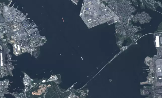 This satellite image provided by Maxar Technologies shows the overview of the Francis Scott Key Bridge in Baltimore, Md., on May 6, 2023. A container ship lost power and rammed into the major bridge in on Tuesday, March 26, 2024, causing the span to buckle into the river below. (Maxaar Technologies via AP)