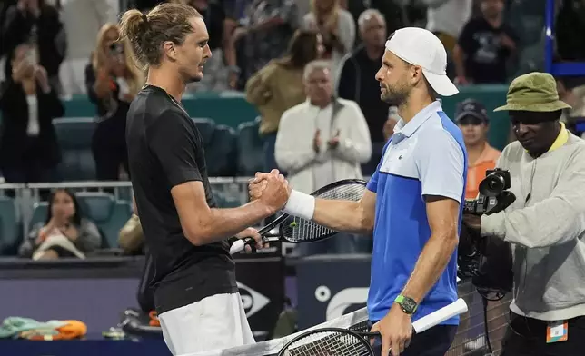 Alexander Zverev, left, of Germany, and Grigor Dimitrov, of Bulgaria, shake hands after Dimitrov won their semifinal at the Miami Open tennis tournament Friday, March 29, 2024, in Miami Gardens, Fla. (AP Photo/Marta Lavandier)
