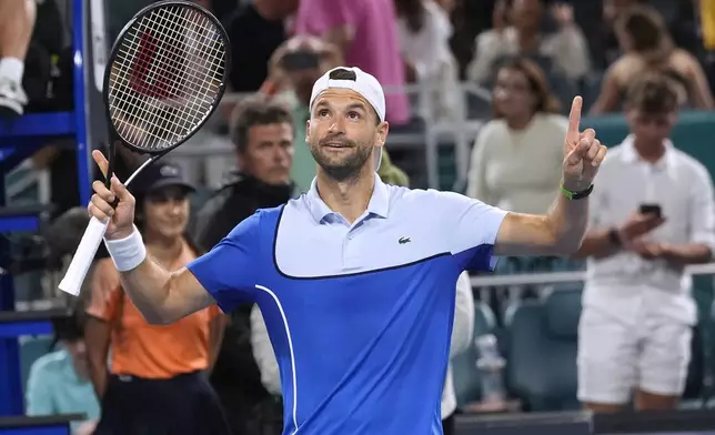 Grigor Dimitrov, of Bulgaria, celebrates after defeating Alexander Zverev, of Germany, in the semifinals of the Miami Open tennis tournament Friday, March 29, 2024, in Miami Gardens, Fla. (AP Photo/Marta Lavandier)