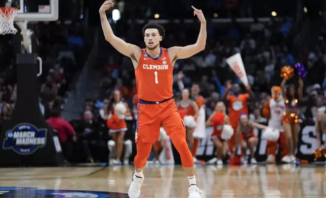 Clemson guard Chase Hunter (1) celebrates after making a 3-point basket during the first half of a Sweet 16 college basketball game against Arizona in the NCAA tournament Thursday, March 28, 2024, in Los Angeles. (AP Photo/Ashley Landis)