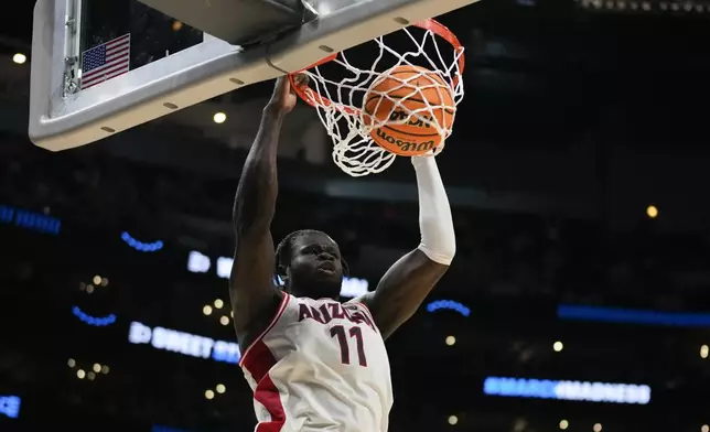 Arizona center Oumar Ballo (11) dunks during the second half of a Sweet 16 college basketball game against Clemson in the NCAA tournament Thursday, March 28, 2024, in Los Angeles. (AP Photo/Ashley Landis)