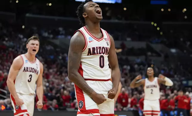 Arizona guard Jaden Bradley (0) celebrates after scoring during the first half of a Sweet 16 college basketball game against Clemson in the NCAA tournament Thursday, March 28, 2024, in Los Angeles. (AP Photo/Ryan Sun)