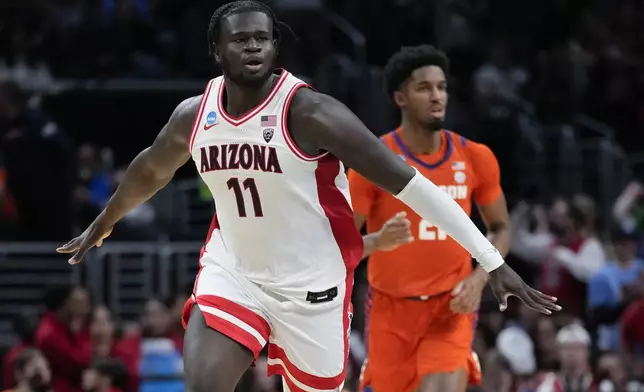 Arizona center Oumar Ballo (11) celebrates after dunking against Clemson during the first half of a Sweet 16 college basketball game in the NCAA tournament Thursday, March 28, 2024, in Los Angeles. (AP Photo/Ashley Landis)