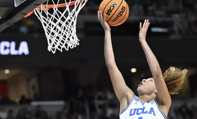 UCLA guard Kiki Rice (1) puts up a shot against the LSU during the second quarter of a Sweet Sixteen round college basketball game during the NCAA Tournament, Saturday, March 30, 2024, in Albany, N.Y. (AP Photo/Hans Pennink)