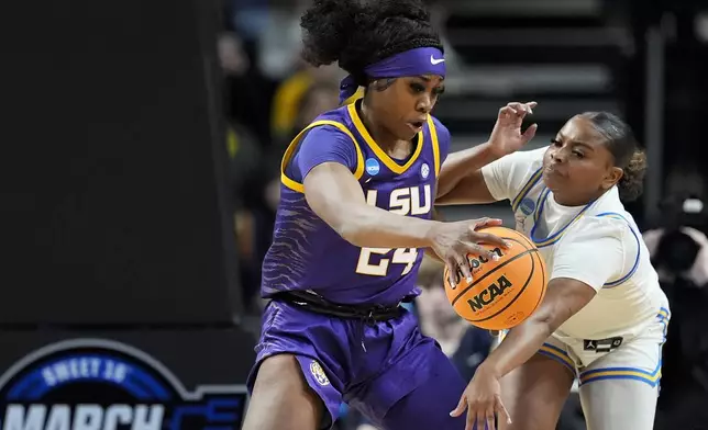UCLA guard Londynn Jones, right, tries to strip the ball from LSU guard Aneesah Morrow (24) during the third quarter of a Sweet Sixteen round college basketball game during the NCAA Tournament, Saturday, March 30, 2024, in Albany, N.Y. (AP Photo/Mary Altaffer)