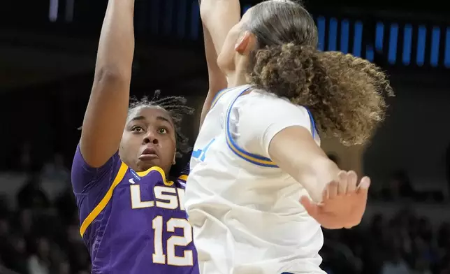 LSU guard Mikaylah Williams (12) shoots against UCLA center Lauren Betts (51) during the second quarter of a Sweet Sixteen round college basketball game during the NCAA Tournament, Saturday, March 30, 2024, in Albany, N.Y. (AP Photo/Mary Altaffer)