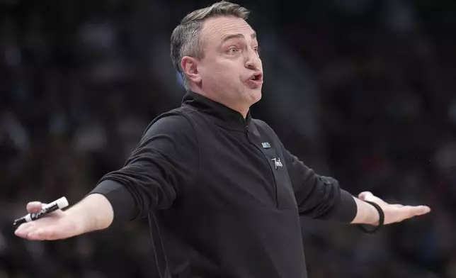 Toronto Raptors head coach Darko Rajakovic expresses his displeasure with officials during the second half of an NBA basketball game against the Brooklyn Nets in Toronto, Monday, March 25, 2024. (Nathan Denette/The Canadian Press via AP)