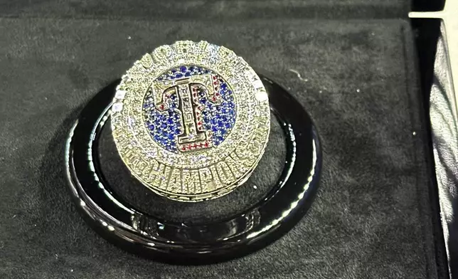 The Texas Rangers championship ring is seen Saturday, March 30, 2024 in Arlington Texas. The Texas Rangers and staff will receive their World Series championship rings during a pre-game ceremony before the Texas Rangers take on the Chicago Cubs in a baseball game. (AP Photo/Stephen Hawkins)