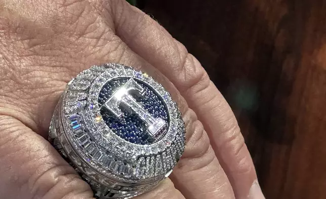 The Texas Rangers championship ring is seen Saturday, March 30, 2024 in Arlington Texas. The Texas Rangers and staff will receive their World Series championship rings during a pre-game ceremony before the Texas Rangers take on the Chicago Cubs in a baseball game. (AP Photo/Stephen Hawkins)