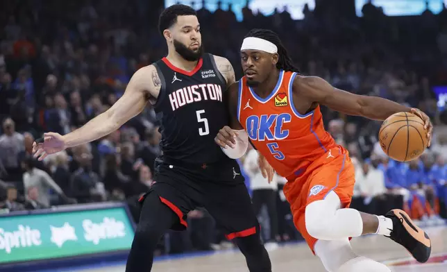 Oklahoma City Thunder guard Luguentz Dort, right, drives against Houston Rockets guard Fred VanVleet during the first half of an NBA basketball game Wednesday, March 27, 2024, in Oklahoma City. (AP Photo/Nate Billings)