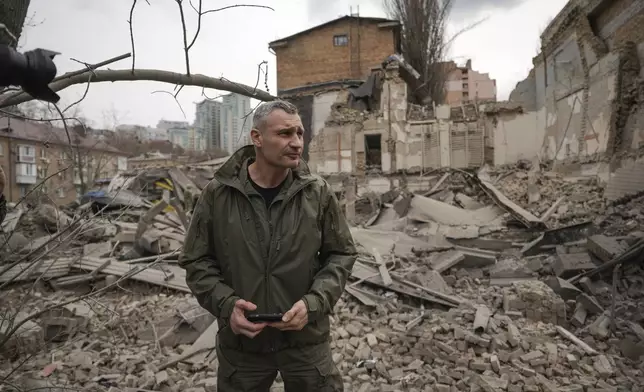 Kyiv Mayor Vitali Klitschko inspects the are of a Russian attack at the Pechersk district react in Kyiv, Ukraine, Monday March 25, 2024. Five people were injured in the strike, two were hospitalised.(AP Photo/Vadim Ghirda)