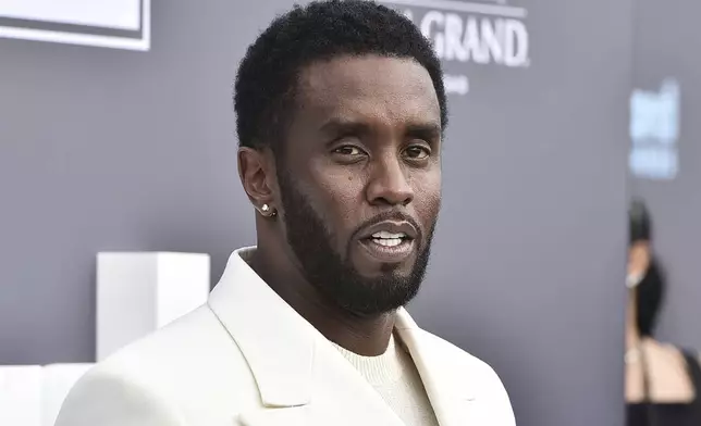 FILE - Music mogul and entrepreneur Sean "Diddy" Combs arrives at the Billboard Music Awards, May 15, 2022, in Las Vegas. Two properties belonging to Combs’ in Los Angeles and Miami were searched Monday, March 25, 2024, by federal Homeland Security Investigations agents and other law enforcement as part of an ongoing sex trafficking investigation, two law enforcement officials told The Associated Press. (Photo by Jordan Strauss/Invision/AP, File)