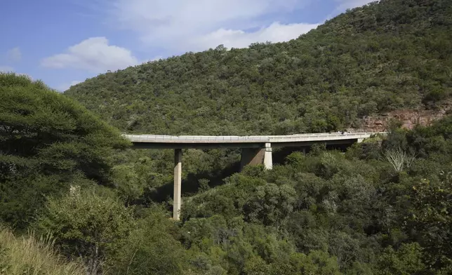 A view of a bridge a day after a bus plunged into a ravine on the Mmamatlakala mountain pass between Mokopane and Marken, around 300km (190 miles) north of Johannesburg, South Africa, Friday, March 29, 2024. A bus carrying worshippers on a long-distance trip from Botswana to an Easter weekend church gathering in South Africa plunged off a bridge on a mountain pass Thursday and burst into flames as it hit the rocky ground below, killing at least 45 people, authorities said. The only survivor was an 8-year-old child who was receiving medical attention for serious injuries. (AP Photo/Themba Hadebe)