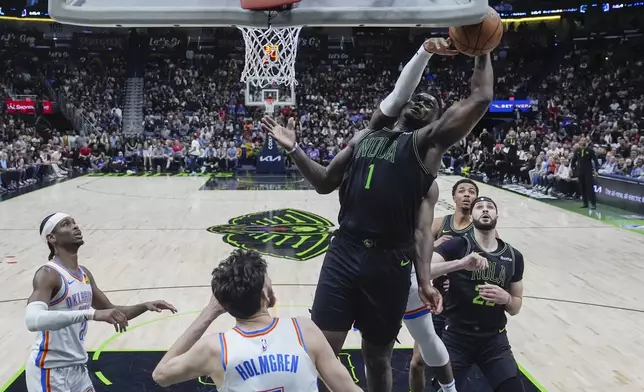 New Orleans Pelicans forward Zion Williamson (1) is blocked as he goes to the basket in the second half of an NBA basketball game against the Oklahoma City Thunder in New Orleans, Tuesday, March 26, 2024. The Thunder won 119-112. (AP Photo/Gerald Herbert)