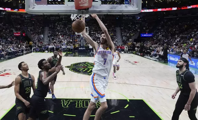 Oklahoma City Thunder forward Chet Holmgren (7) slam dunks in the first half of an NBA basketball game against the New Orleans Pelicans in New Orleans, Tuesday, March 26, 2024. (AP Photo/Gerald Herbert)
