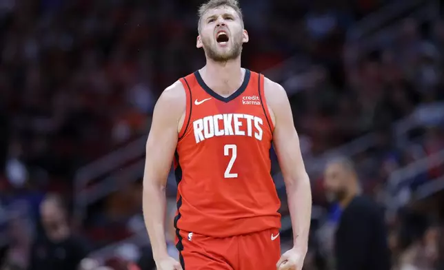 Houston Rockets center Jock Landale reacts after sinking a 3-point shot against the Portland Trail Blazers during the first half of an NBA basketball game Monday, March 25, 2024, in Houston. (AP Photo/Michael Wyke)