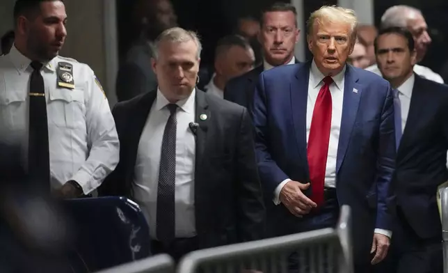 FILE - Former President Donald Trump leaves Manhattan criminal court, Feb. 15, 2024, in New York. Trump's hush money case is set for a crucial hearing Monday, March 25, as a judge weighs when or even whether Trump will go on trial. (AP Photo/Mary Altaffer, File)