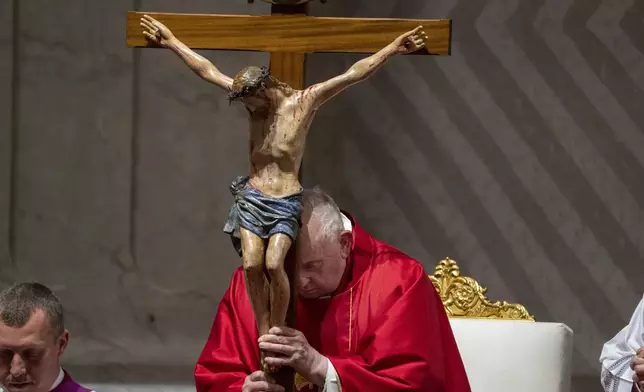 Pope Francis leads the liturgy of the Passion on Good Friday in St. Peter's Basilica at The Vatican, Friday, March 29, 2024. (AP Photo/Domenico Stinellis)