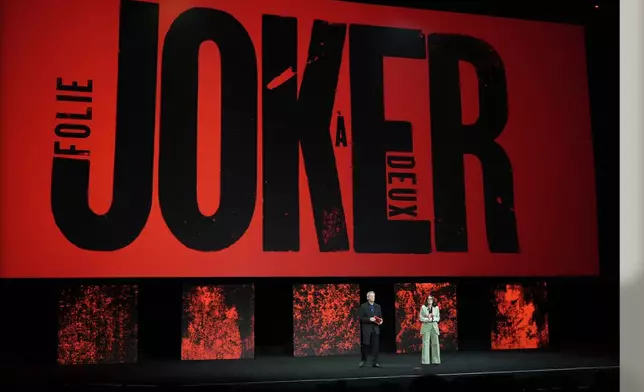 Michael De Luca, left, and Pamela Abdy, co-chairpersons and CEOs of Warner Bros. Motion Picture Group, introduce a trailer for the upcoming film "Joker: Folie a Deux" during the Warner Bros. Pictures presentation at CinemaCon 2024, Tuesday, April 9, 2024, in Las Vegas. (AP Photo/Chris Pizzello)