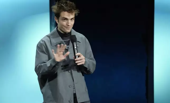 Robert Pattinson, star of the upcoming film "Mickey 17," discusses the film during the Warner Bros. Pictures presentation at CinemaCon 2024, Tuesday, April 9, 2024, in Las Vegas. (AP Photo/Chris Pizzello)