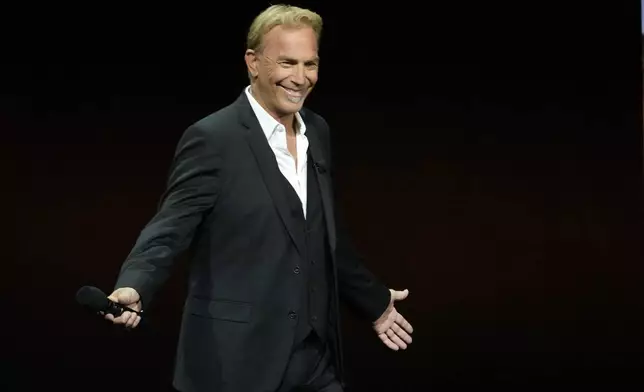 Kevin Costner, the director and star of the upcoming film "Horizon: An American Saga," arrives onstage during the Warner Bros. Pictures presentation at CinemaCon 2024, Tuesday, April 9, 2024, in Las Vegas. (AP Photo/Chris Pizzello)