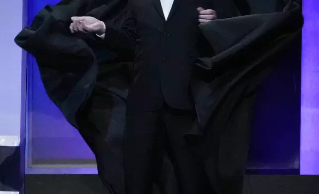 Actor Mike Myers wears a cloak and mask in reference to the 1999 film "Eyes Wide Shut" during the 49th AFI Life Achievement Award tribute to Nicole Kidman, Saturday, April 27, 2024, at the Dolby Theatre in Los Angeles. Kidman was one of the stars of the film, which was directed by the late Stanley Kubrick. (AP Photo/Chris Pizzello)