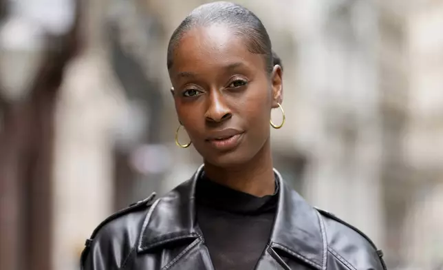 Fashion model Alexsandrah poses for a photograph, in London, Friday, March 29, 2024. The use of computer-generated supermodels has complicated implications for diversity. Although AI modeling agencies -- some of them Black-owned -- can render models of all races, genders and sizes at the click of a finger, real models of color who have historically faced higher barriers to entry may be put out of work. (AP Photo/Kirsty Wigglesworth)