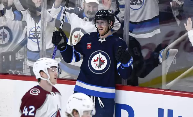 Winnipeg Jets left wing Kyle Connor (81) celebrates a goal against the Colorado Avalanche during the third period in Game 1 of an NHL hockey Stanley Cup first-round playoff series in Winnipeg, Manitoba, Sunday, April 21, 2024. (Fred Greenslade/The Canadian Press via AP)