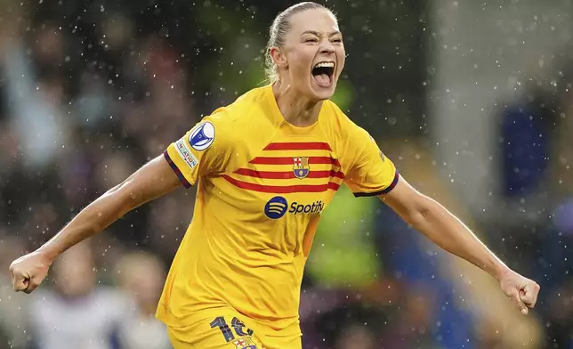 Barcelona's Fridolina Rolfo celebrates after scoring her side's second goal during the Women's Champions League, semi final second leg, soccer match between FC Chelsea and FC Barcelona in London, England, Saturday, April 27, 2024. (Zac Goodwin/PA via AP)