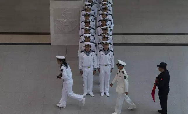 Chinese sailors visit the Chinese People's Liberation Army Naval Museum in Qingdao in eastern China's Shandong province on Tuesday, April 23, 2024. (AP Photo/Ng Han Guan)