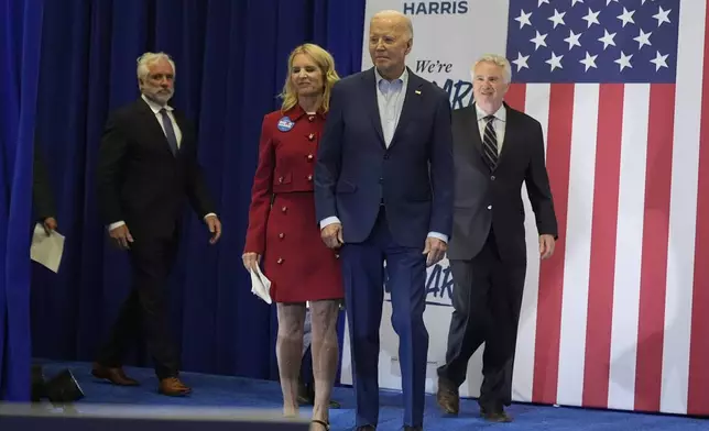 President Joe Biden, second from right, and members of the Kennedy family including Maxwell Kennedy Sr., from left, Kerry Kennedy and Christopher Kennedy walk on stage at a campaign event, Thursday, April 18, 2024, in Philadelphia. (AP Photo/Alex Brandon)