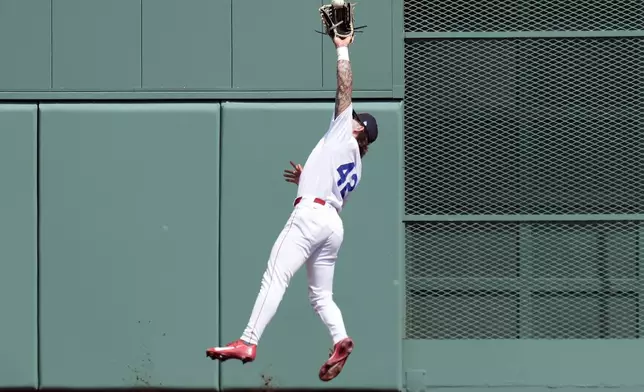 Boston Red Sox's Jarren Duran makes the catch on the fly out by Cleveland Guardians' Andrés Giménez during the fourth inning of a baseball game, Monday, April 15, 2024, in Boston. (AP Photo/Michael Dwyer)