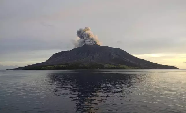 This photo provided by the Indonesian National Search and Rescue Agency (BASARNAS) shows a view of an eruption of Mount Ruang in the Sulawesi island, Indonesia, Friday, April 19, 2024. More people living near the erupting volcano on Indonesia's Sulawesi Island were evacuated on Friday due to the dangers of spreading ash, falling rocks, hot volcanic clouds and the possibility of a tsunami. (National Search and Rescue Agency via AP)
