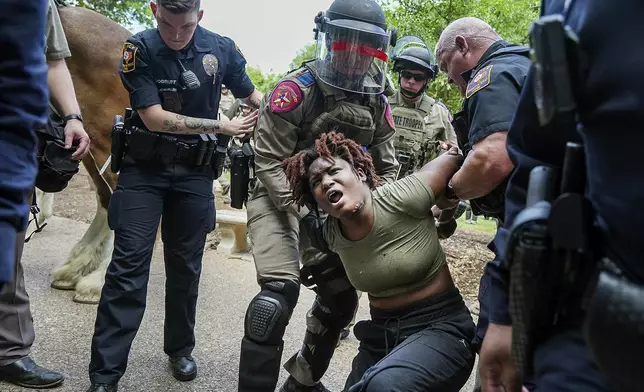 A demonstrator is arrested at a pro-Palestinian protest at the University of Texas, Wednesday, April 24, 2024, in Austin, Texas. (Ricardo B. Brazziell/Austin American-Statesman via AP)