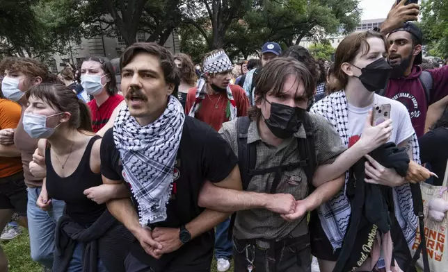 Demonstrators chant at a pro-Palestinian protest at the University of Texas, Wednesday, April 24, 2024, in Austin, Texas. (Mikala Compton/Austin American-Statesman via AP)