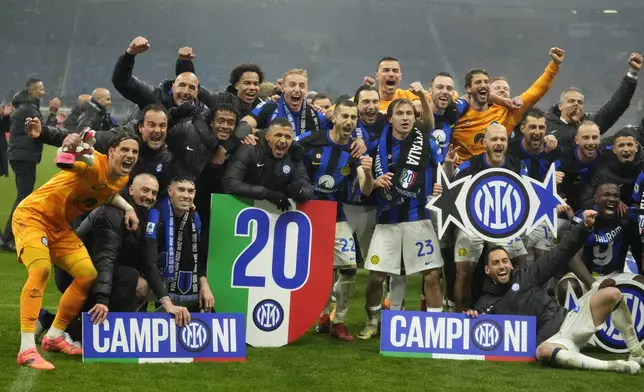 Inter Milan players celebrate at the end of the Serie A soccer match between AC Milan and Inter Milan at the San Siro stadium in Milan, Italy, Monday, April 22, 2024. (AP Photo/Luca Bruno)