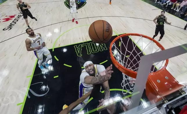 Los Angeles Lakers forward Anthony Davis goes to the basket in the second half of an NBA basketball game against the New Orleans Pelicans in New Orleans, Sunday, April 14, 2024. The Lakers won 124-108. (AP Photo/Gerald Herbert)